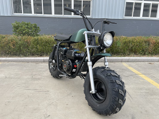 Green 200cc Muddy Dirt Bike Front View